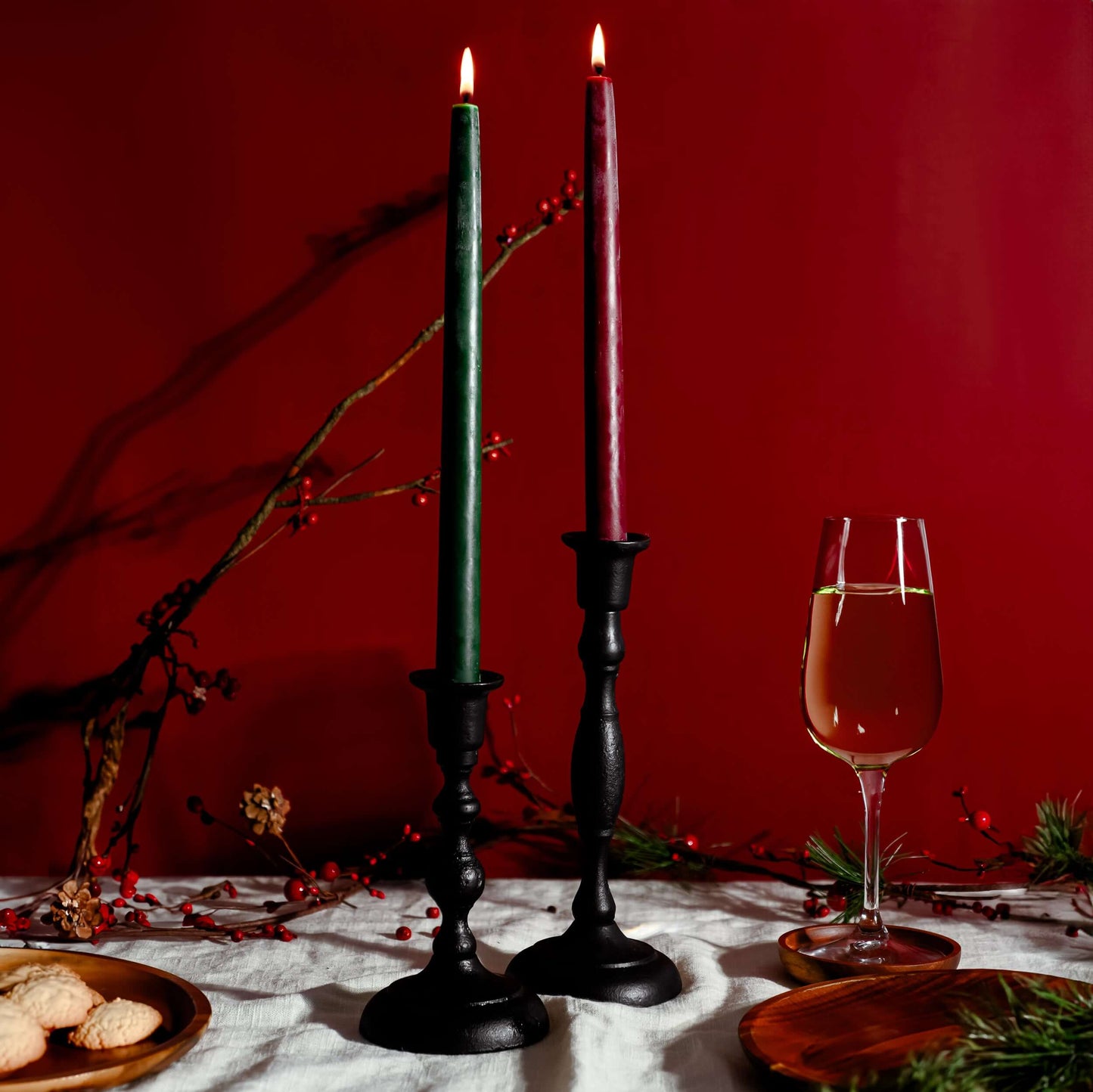 Pair of red and green hand-dipped beeswax taper candles from Bluecorn Candles, showcasing natural beeswax finish and slender design.