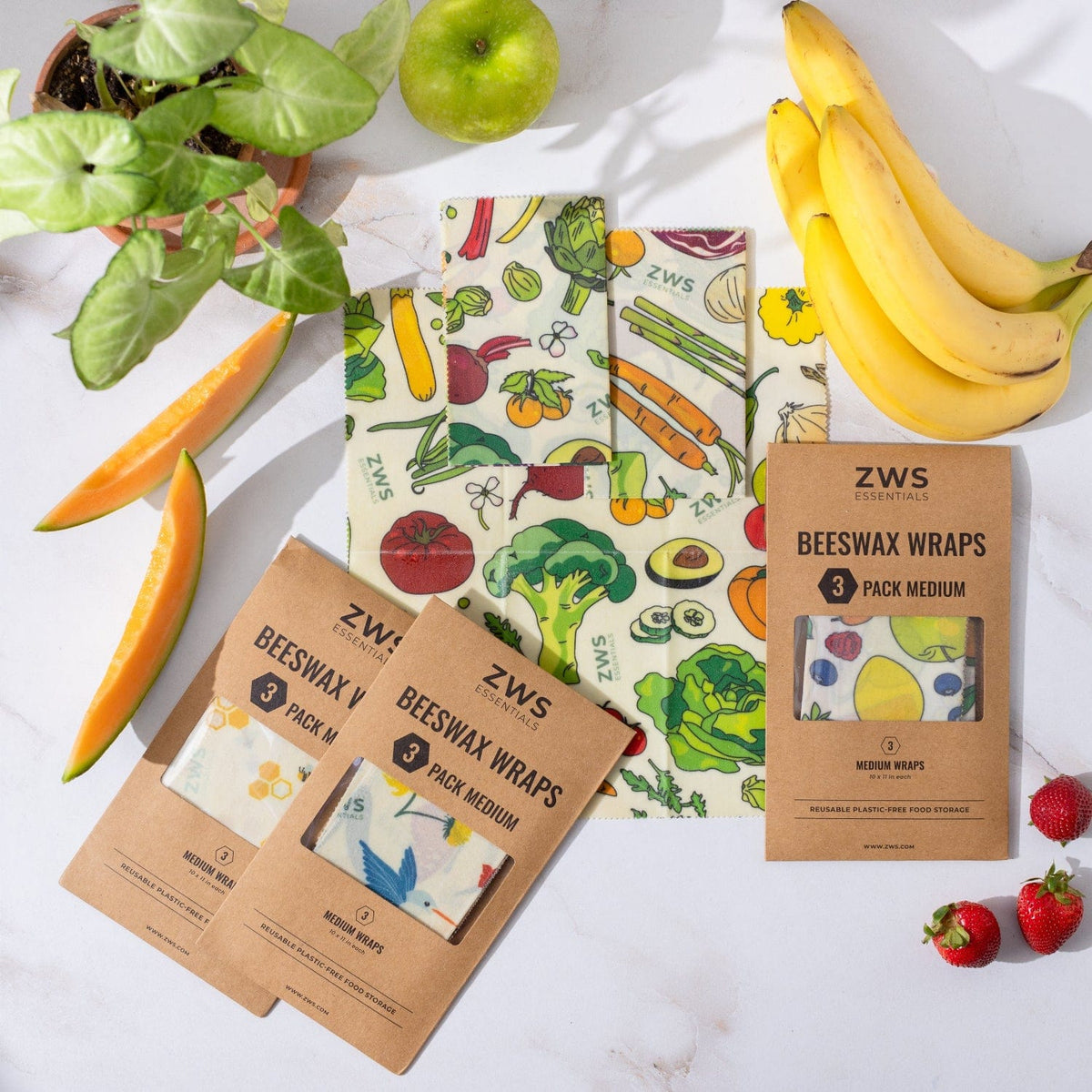 Three medium-sized beeswax wraps in a box, natural and eco-friendly food wraps from ZeroWasteStore.com for plastic-free storage.