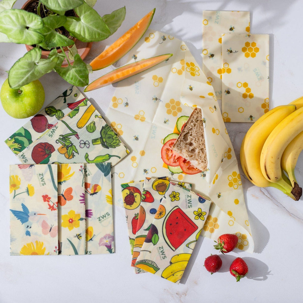 Set of four colorful beeswax wraps for food storage, flat lay showing eco-friendly, plastic-free wraps from ZeroWasteStore.com.
