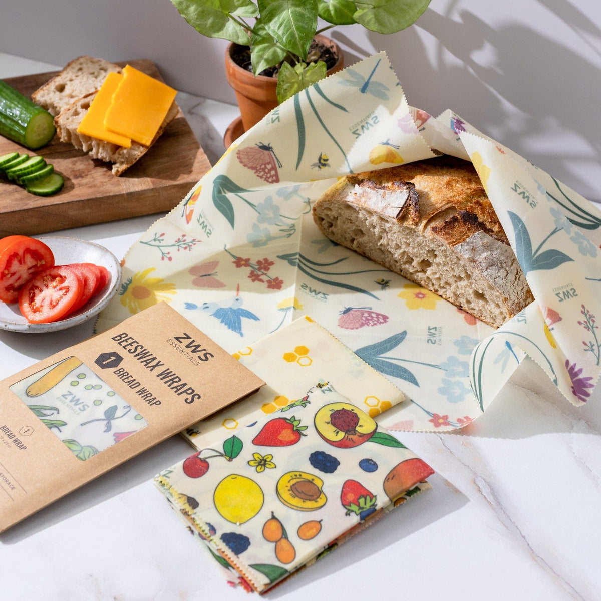Beeswax wraps from ZeroWasteStore.com with pollinator design, reusable food wraps for plastic-free storage, bread and snack coverage.