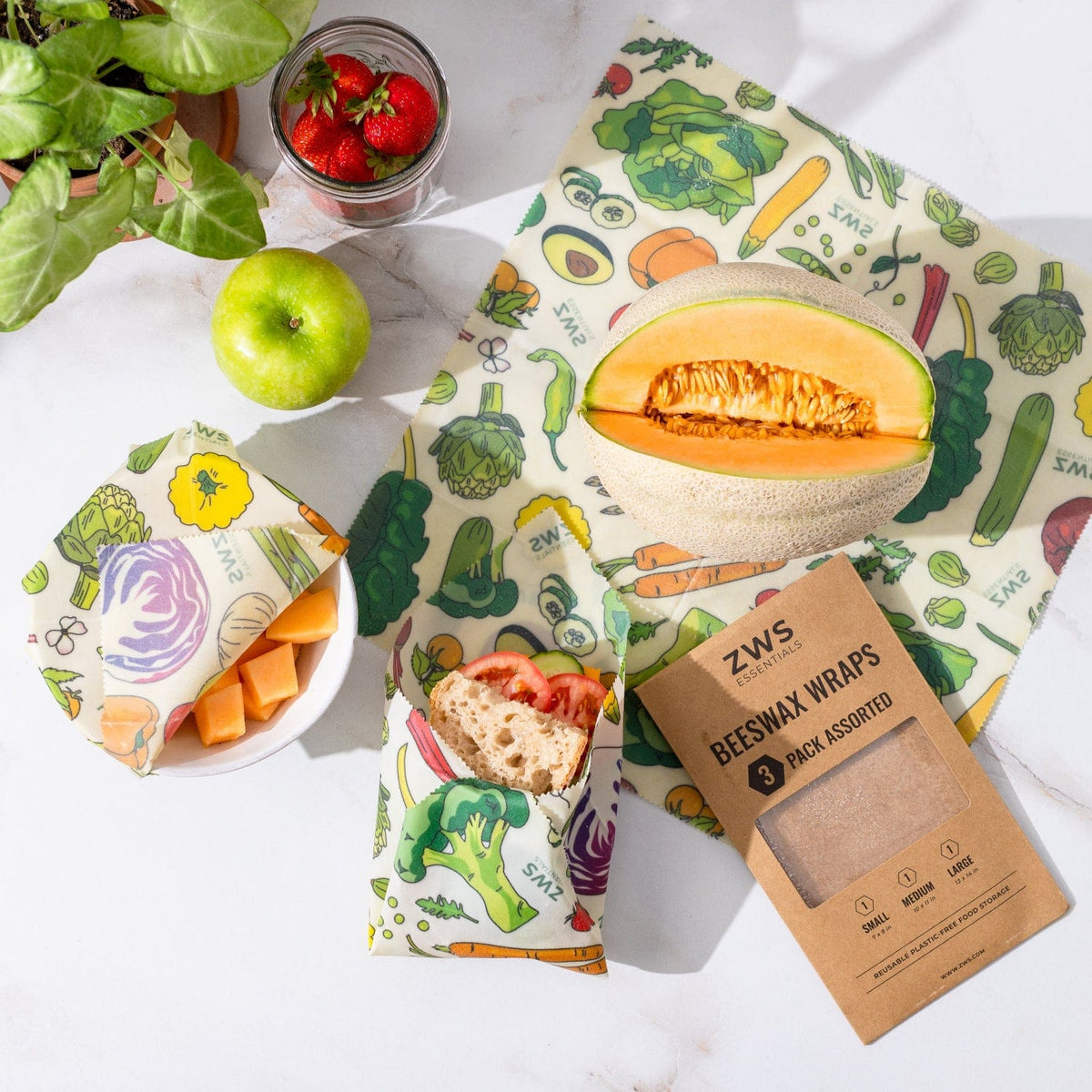 Three assorted beeswax wraps from ZeroWasteStore.com, used for eco-friendly, plastic-free food storage around vegetables.
