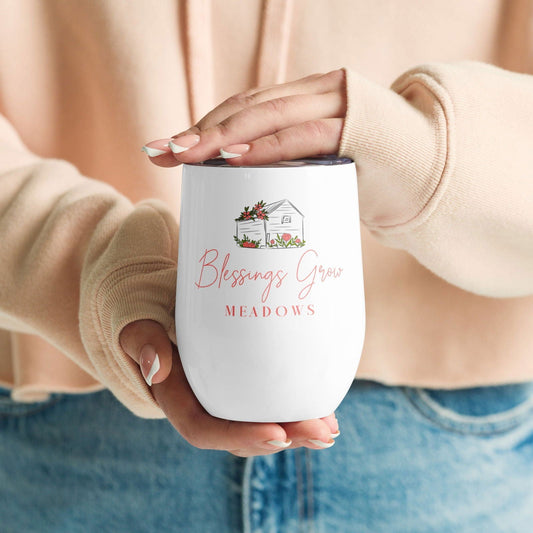 Blessings Grow Meadows logo tumbler, housewares item with a colorful Blessings Grow Meadows design and logo on a reusable tumbler.