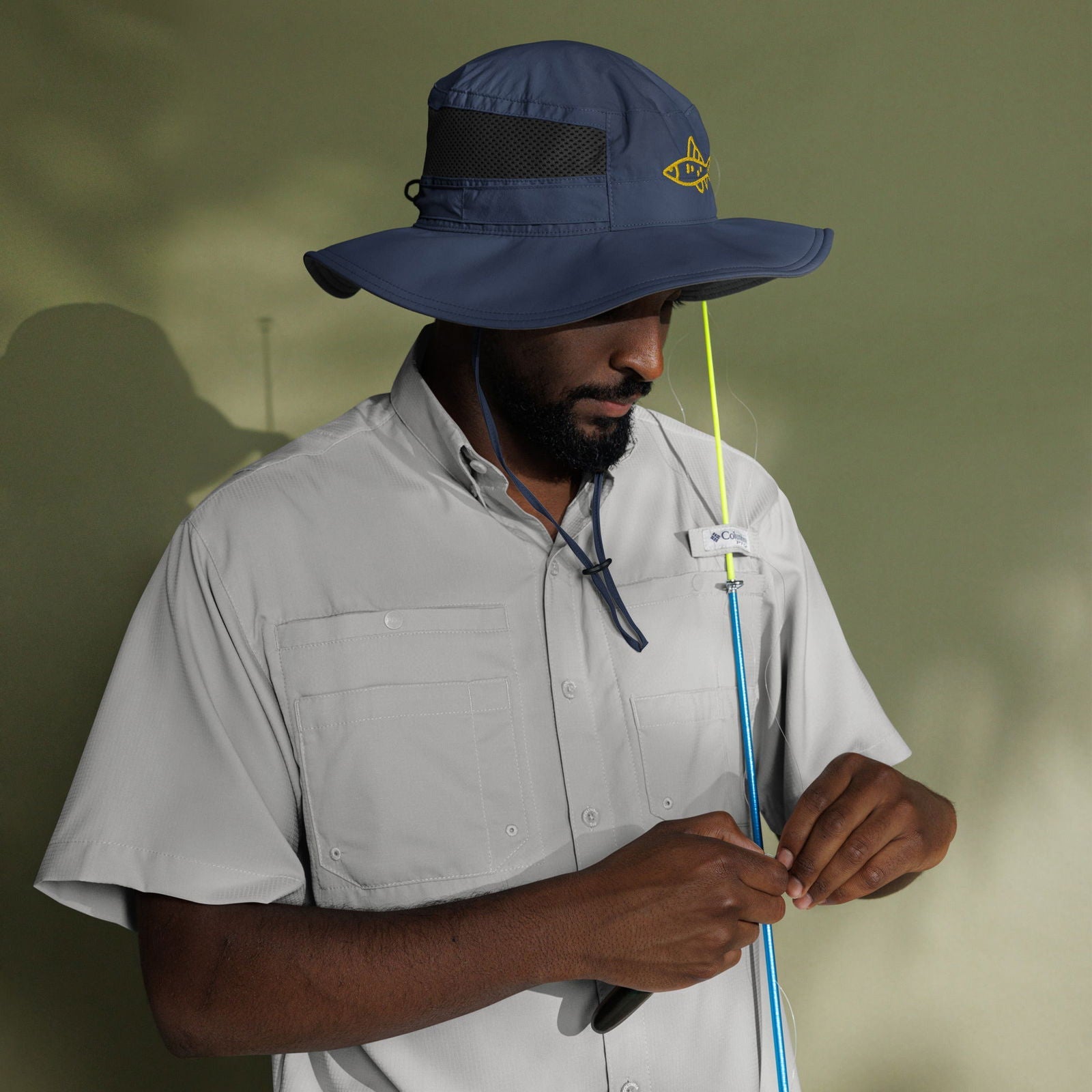 Blessings Grow Meadows Merch Columbia Fish Booney Hat in collegiate navy with BGM designed branding and embroidered fish detail.
