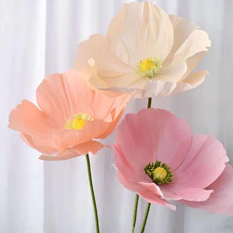 Six large free-standing paper flowers for event decor, provided by Blessings Grow Meadows Merch, for rental in Metter, GA.