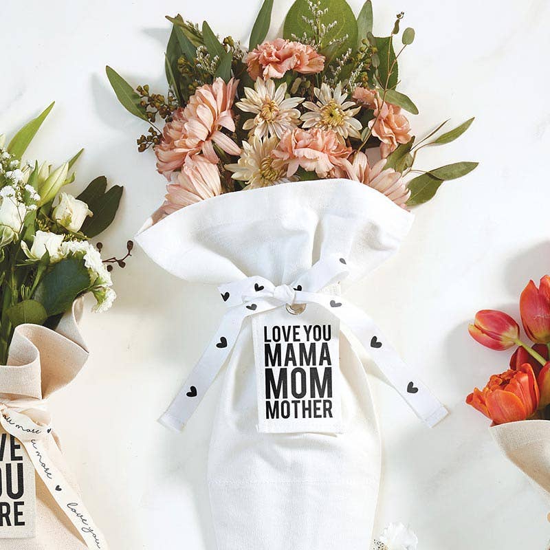 Cream-colored Bouquet Bag labeled "Mama" from Blessings Grow Meadows Merch & More, featuring floral accessories and durable handles.