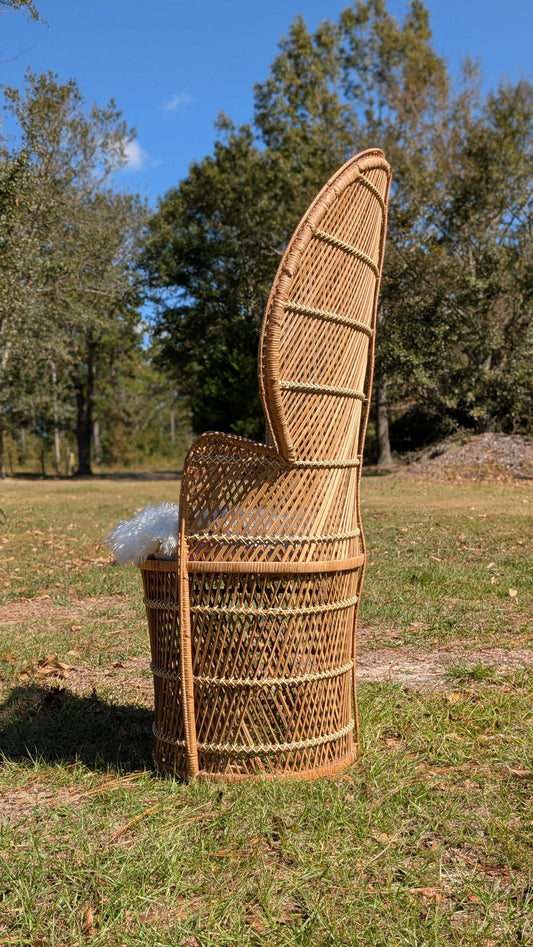 Two vintage boho peacock chairs in natural wood finish, designed for event rentals, available for pickup in Metter, GA.