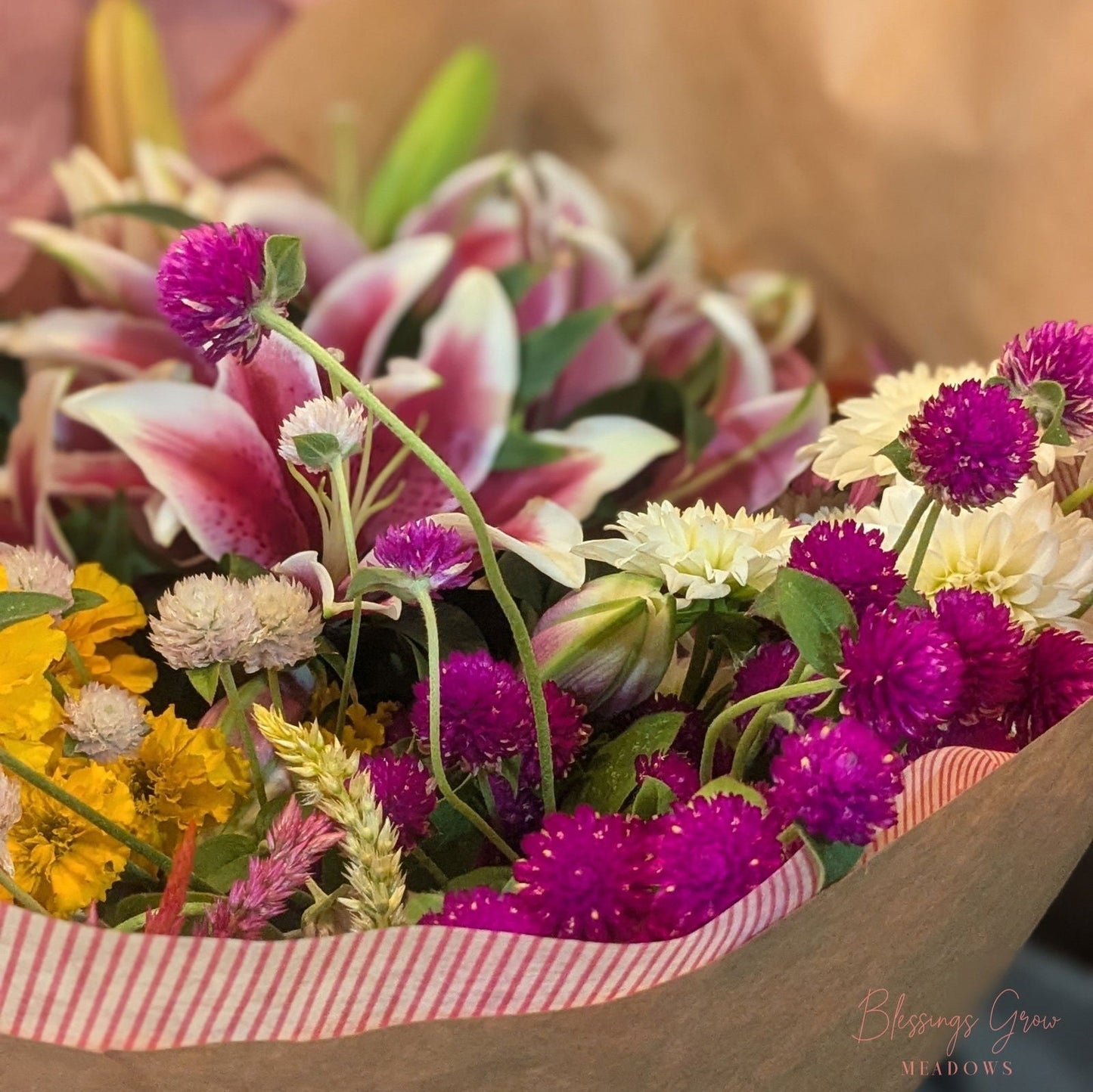 Colorful DIY event flowers and fresh greenery in bloom buckets from Blessings Grow Meadows for bulk floral arrangements.
