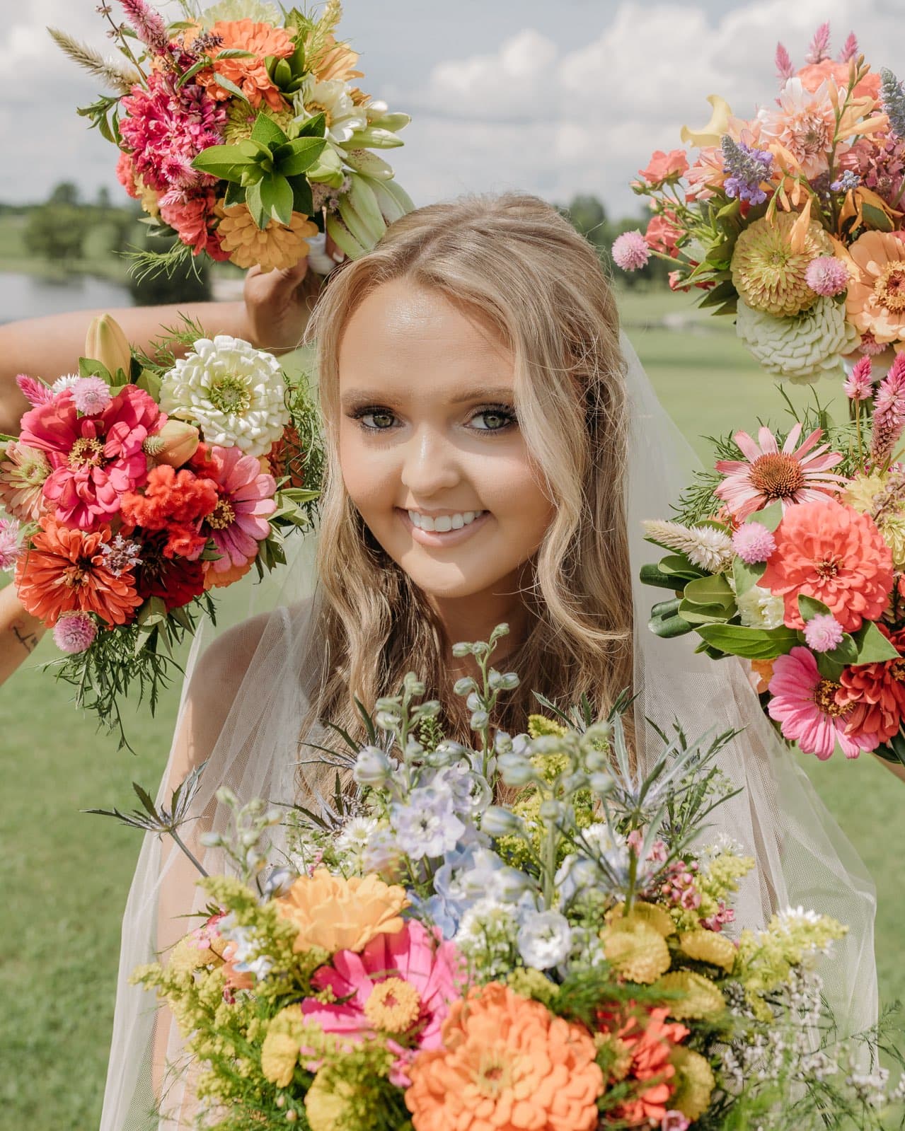 Colorful DIY event flowers and fresh greenery in bloom buckets, perfect for floral arrangements, from Blessings Grow Meadows Merch & More.