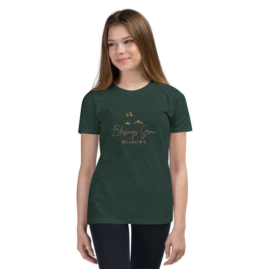 Navy Youth Blessings Grow Meadows Comfort Colors T-shirt featuring a colorful meadow design on the front.