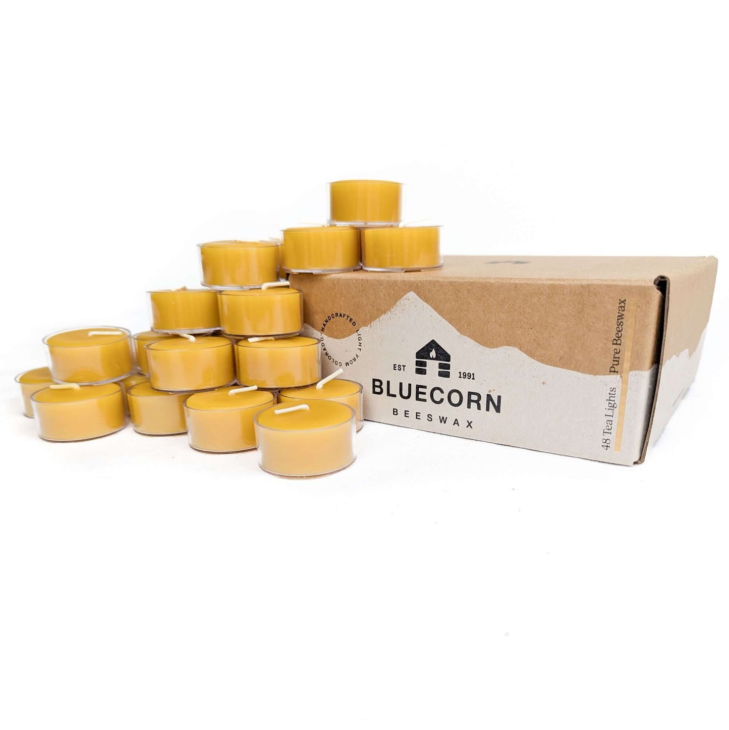 Set of 48 Bluecorn Candles pure beeswax tea light candles in aluminum cups, raw and ready for use, on a white background.