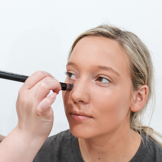 Taylor Made Organics under-eye color corrector concealer with blurring brush for dark circles and skin tone correction.