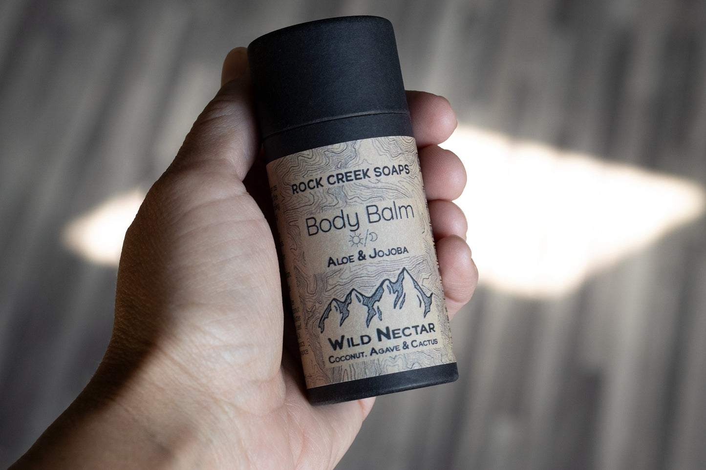 Wild Nectar Body Balm solid lotion bar by Rock Creek Soaps, featuring blue agave, coconut, cactus, and citrus ingredients.