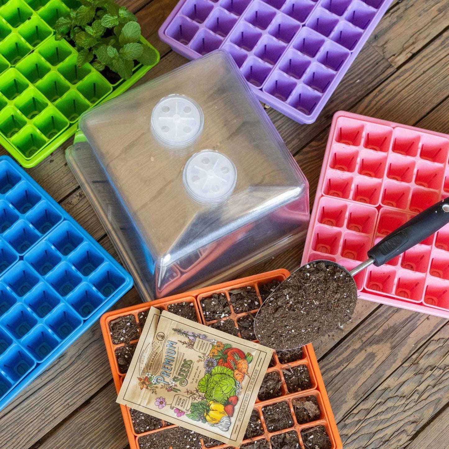Blue Bootstrap Farmer 1010 seed starter trays with humidity domes, designed for backyard gardeners, perfect for starting seeds indoors.