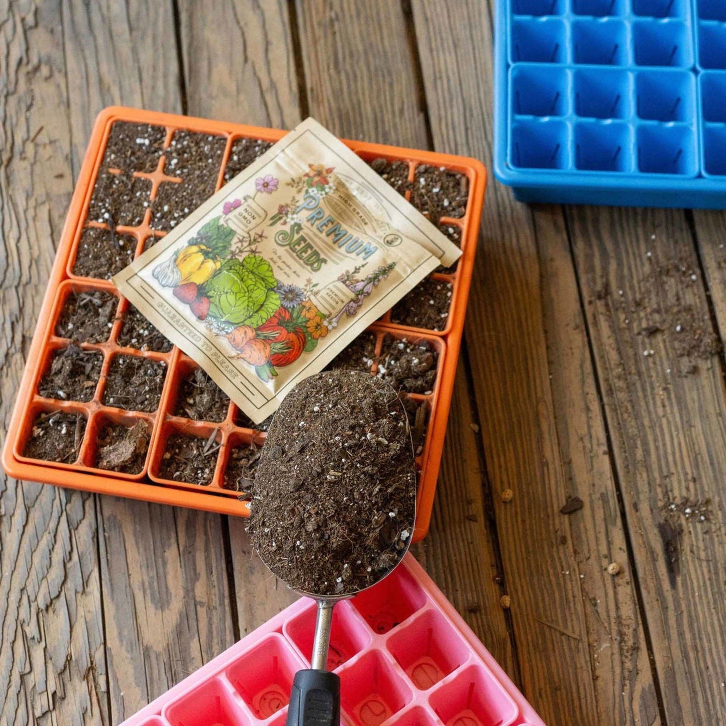 Blue Bootstrap Farmer 1010 seed starter trays with humidity domes for backyard gardening, ideal for seed germination and plant growth.