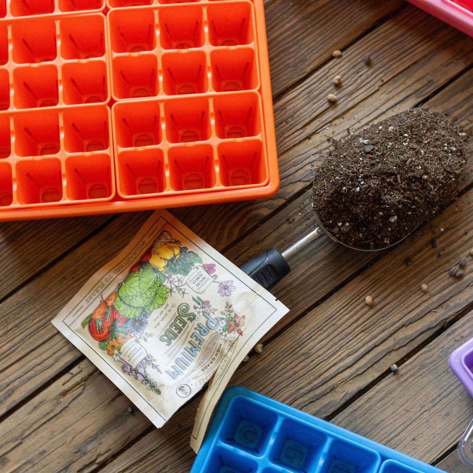Blue Bootstrap Farmer 1010 seed starter tray with humidity domes, designed for backyard gardeners to start seeds indoors.