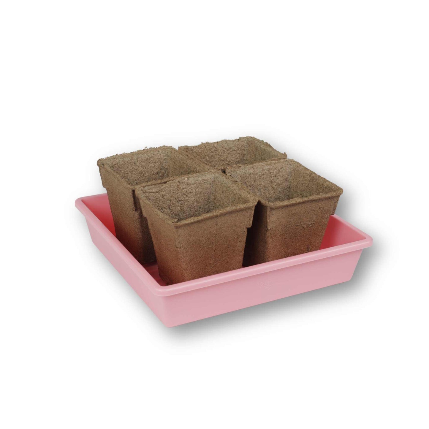Set of four CowPots® #4 Square biodegradable plant pots by Bootstrap Farmer, shown filled with soil for seedlings.