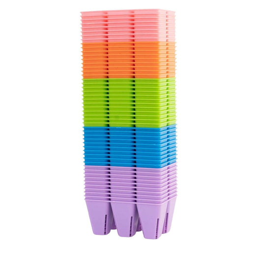 Six colorful Bootstrap Farmer 6-cell plug tray inserts for seed starting in black plastic cell trays.