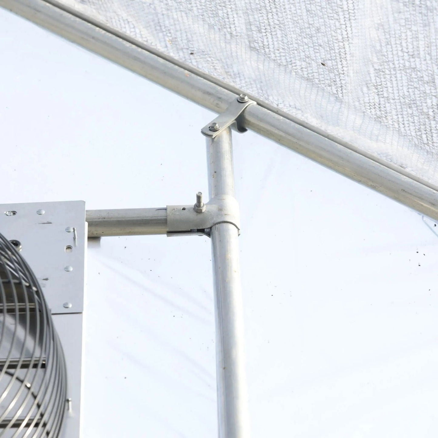 Bootstrap Farmer greenhouse shutter mount exhaust fans in green, showing the fans installed inside a greenhouse for ventilation.