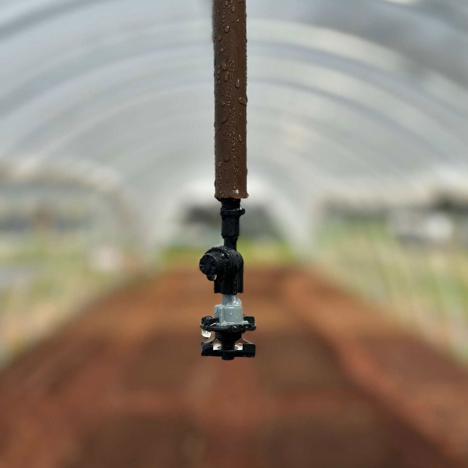Bootstrap Farmer overhead irrigation kit for gardens, featuring hoses, emitters, and connectors for efficient watering.