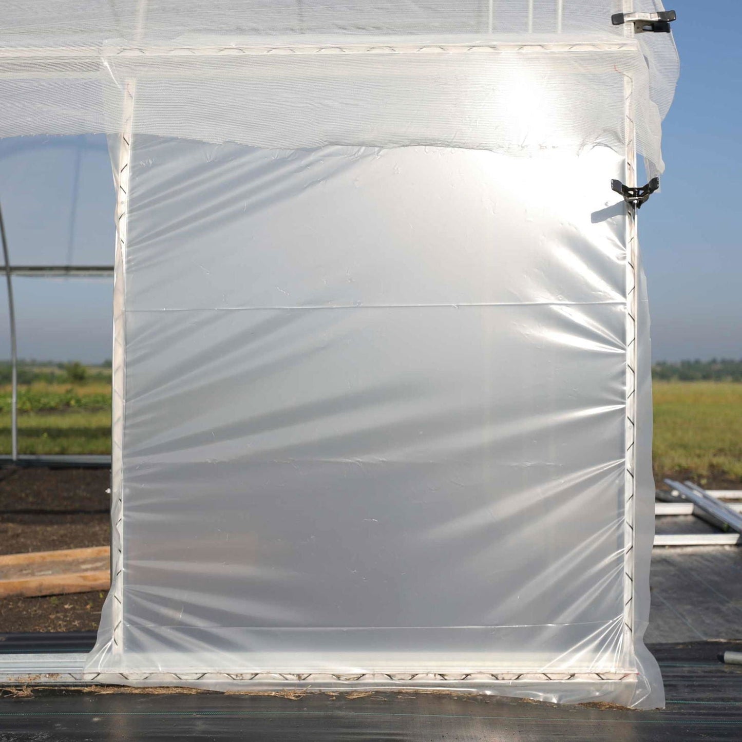 Bootstrap Farmer wind panel kit for garden protection, showing lightweight fabric panels with support poles and secure fastenings.