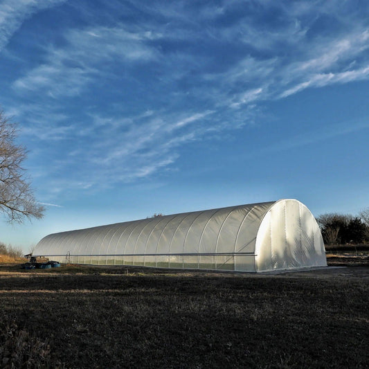 All-metal round hoop house kit for greenhouse gardening by Bootstrap Farmer, featuring sturdy metal frame and clear plastic cover.