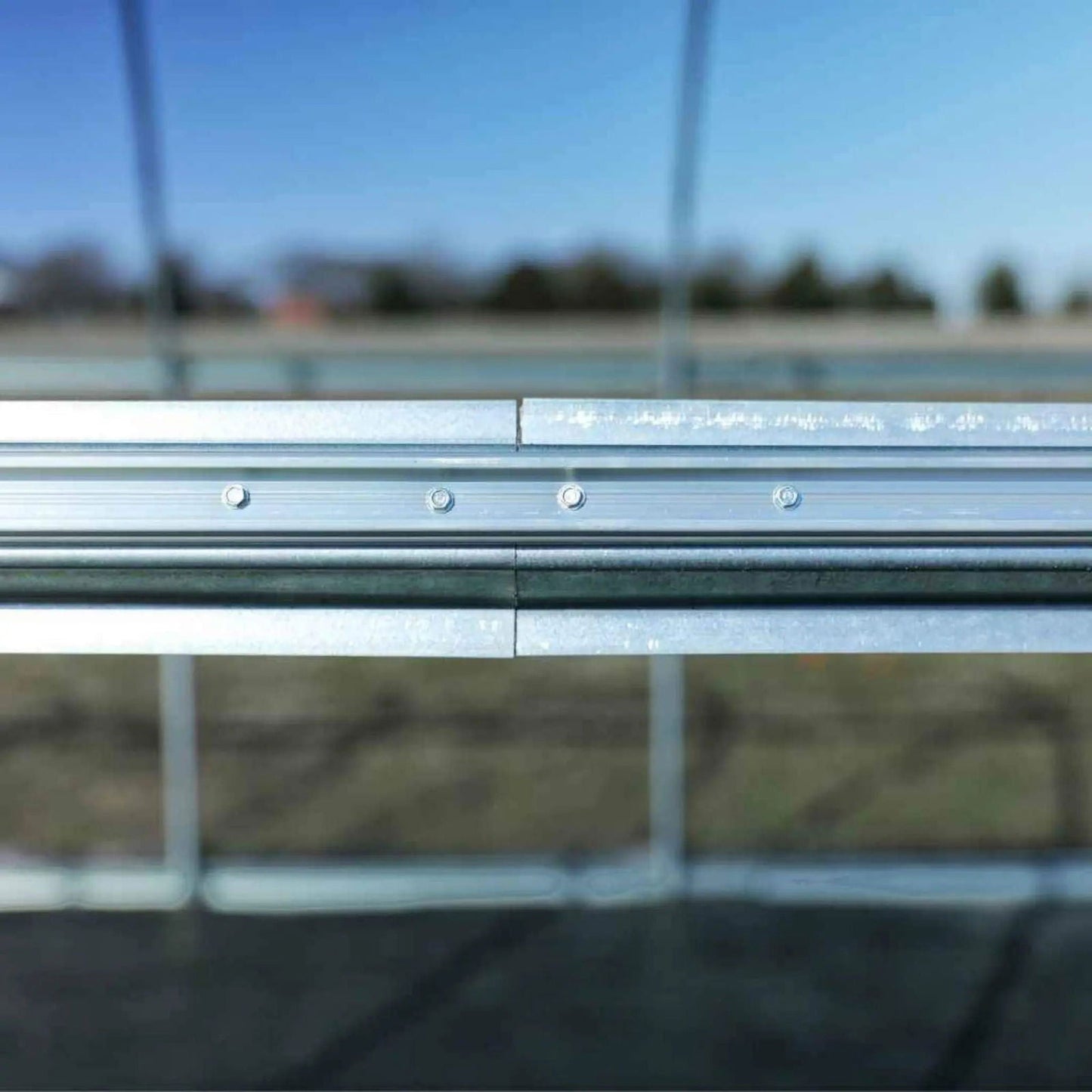 All-metal round hoop house greenhouse kit by Bootstrap Farmer with sturdy metal frame, clear plastic covering, ideal for plant protection.