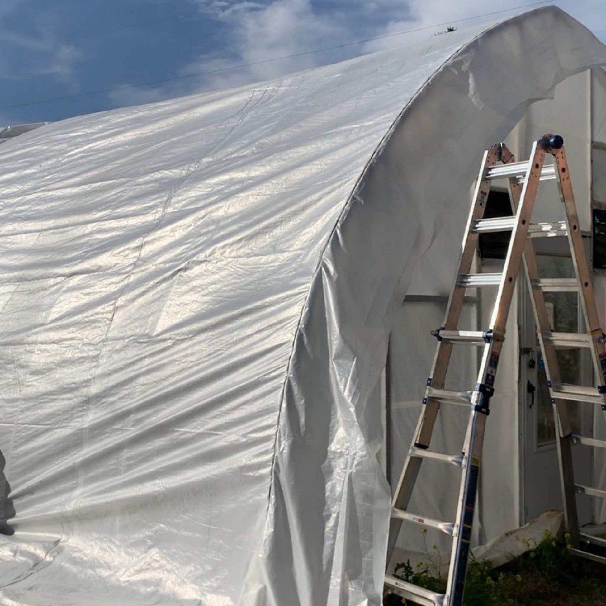 Greenhouse woven plastic film by Bootstrap Farmer, 8 mil solarig greenhouse plastic for durable plant protection and growth.