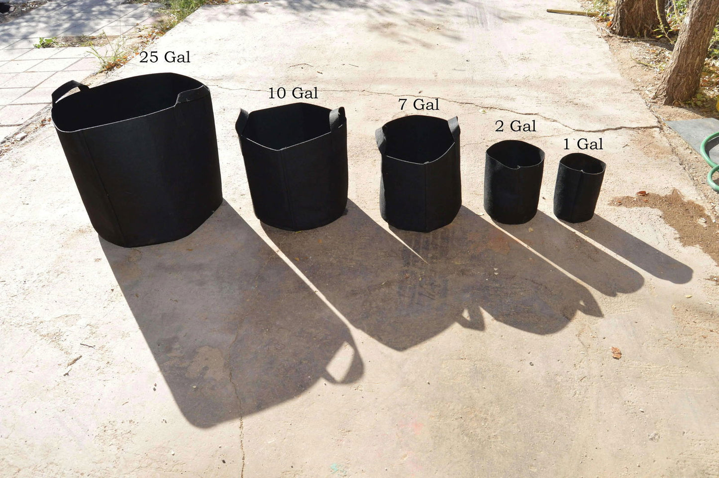 Set of black Bootstrap Farmer grow bags in various sizes from 2 to 50 gallons, suitable for gardening and plant cultivation.