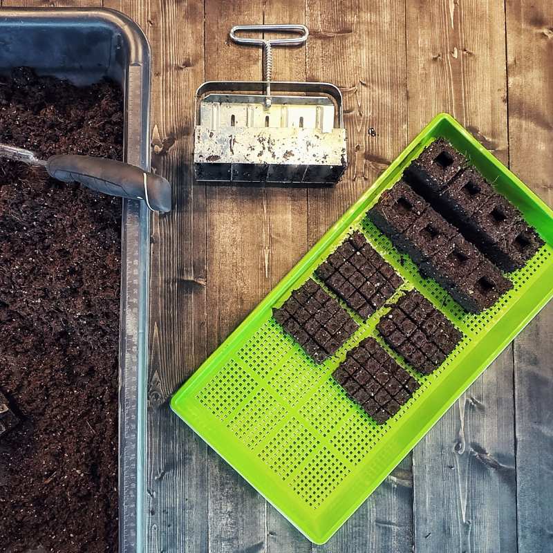 Set of four 2-inch Ladbrooke Soil Blockers by Bootstrap Farmer for creating growing media soil blocks.