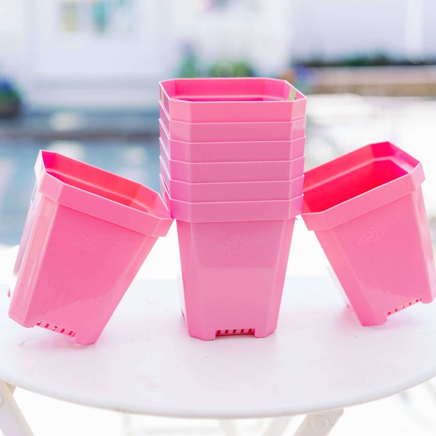 Set of eight multicolor 5-inch heavy-duty seed starting pots by Bootstrap Farmer, ideal for gardening and plant propagation.