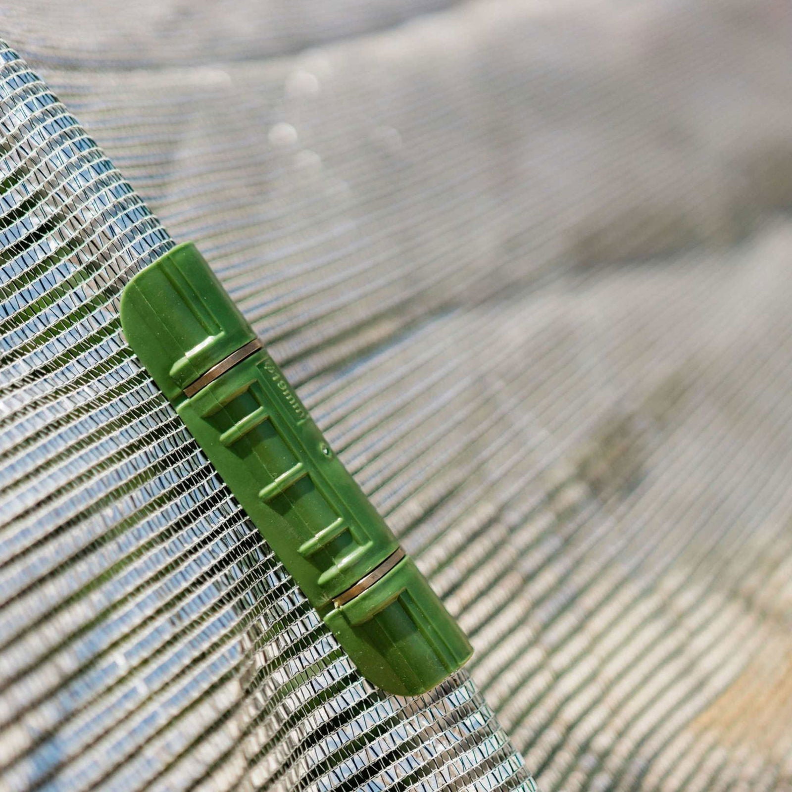 Aluminum white shade cloth from Bootstrap Farmer, 50% shade, outdoor gardening and sun protection, close-up of fabric texture.