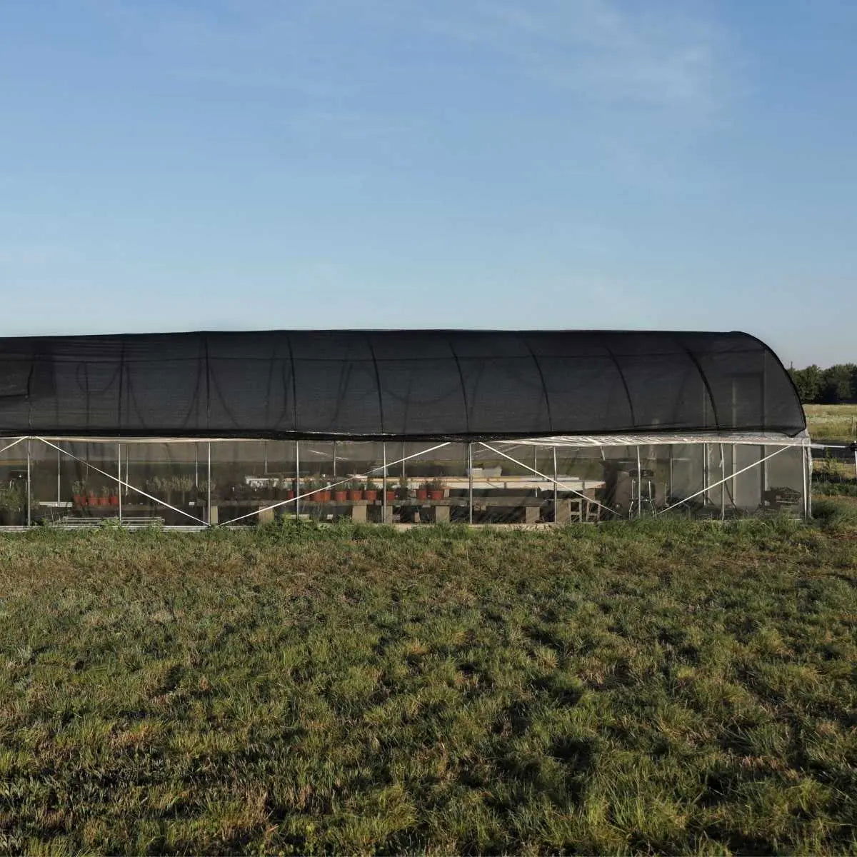 Greenhouse shade cloth by Bootstrap Farmer, 30% black shade, durable fabric for outdoor plant protection and temperature control.