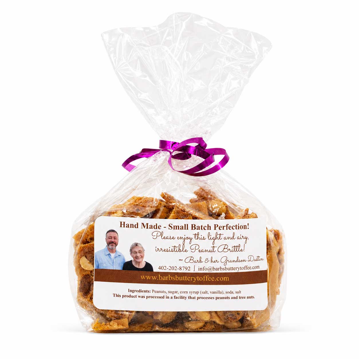 Homemade peanut brittle by Barb's Buttery Toffee, 8 oz, golden, crunchy snack with peanuts, on a white background.