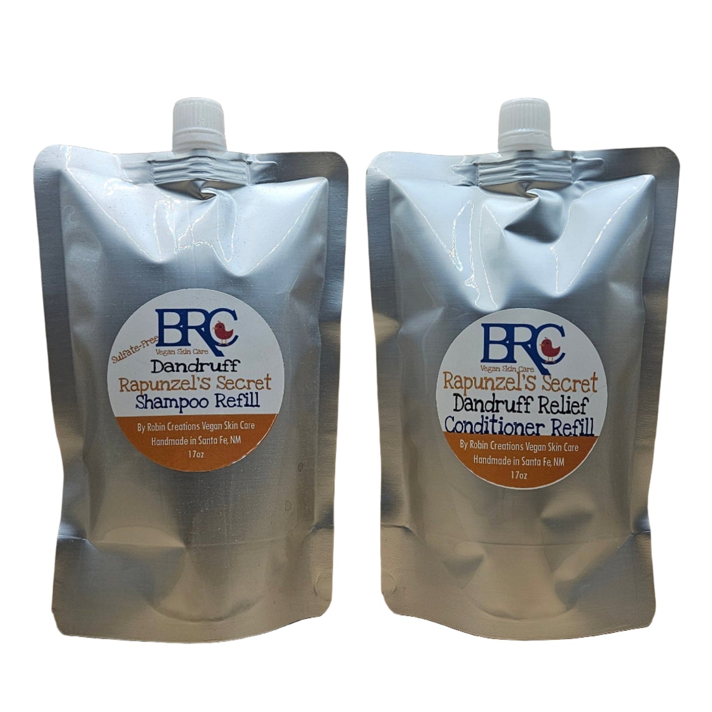 By Robin Creations dandruff relief liquid shampoo and conditioner in 8 oz biodegradable pump bottles, showing the product bottles.