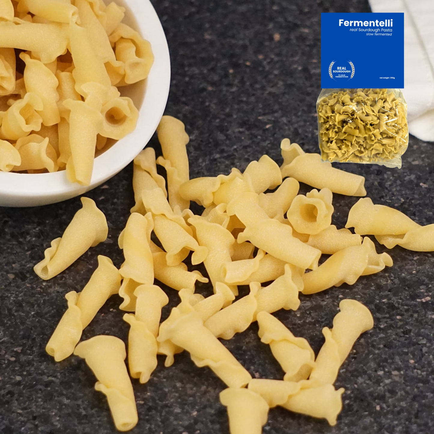 Fermentelli Pasta sourdough pasta combo pack featuring various shapes, displayed in a rustic setting with a wooden surface.
