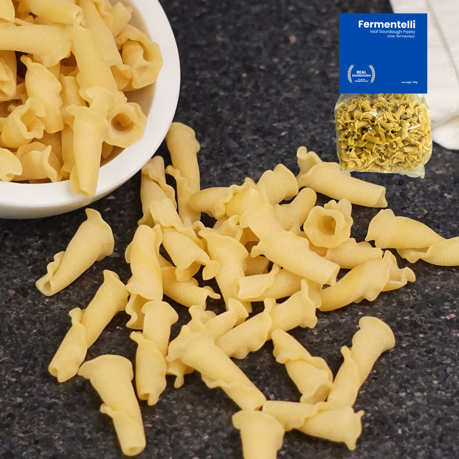 Fermentelli Pasta sourdough pasta combo pack featuring various shapes, displayed in a rustic setting with a wooden surface.