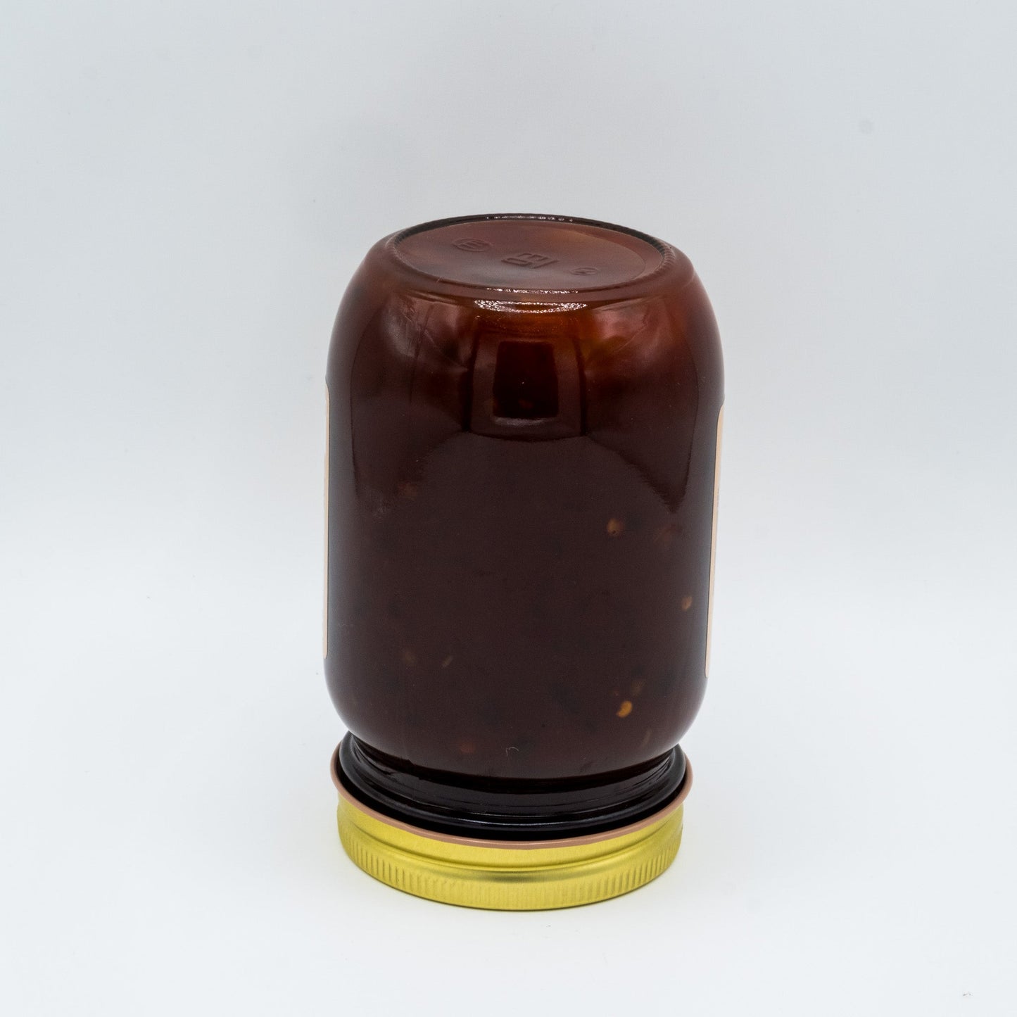 Canned Amish Country Store Candied Jalapeno BBQ Sauce in 16 oz jar showing the label and sauce inside