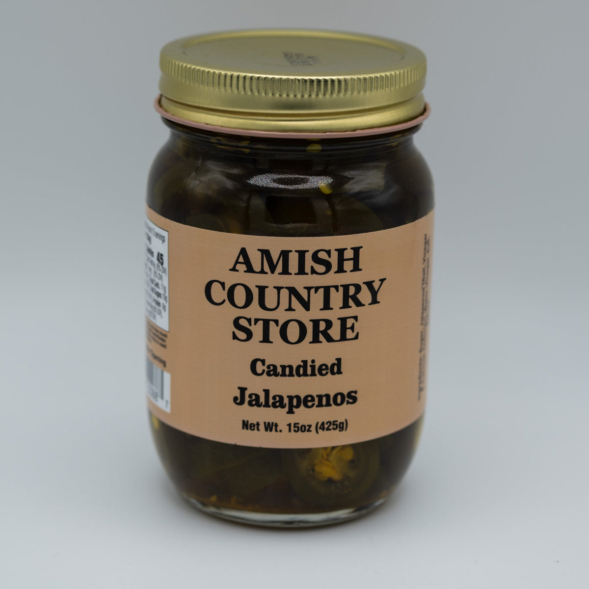 Canned candied jalapenos from Amish Country Store in a 16 oz jar, showing glossy, sweet and spicy jalapeno slices inside.
