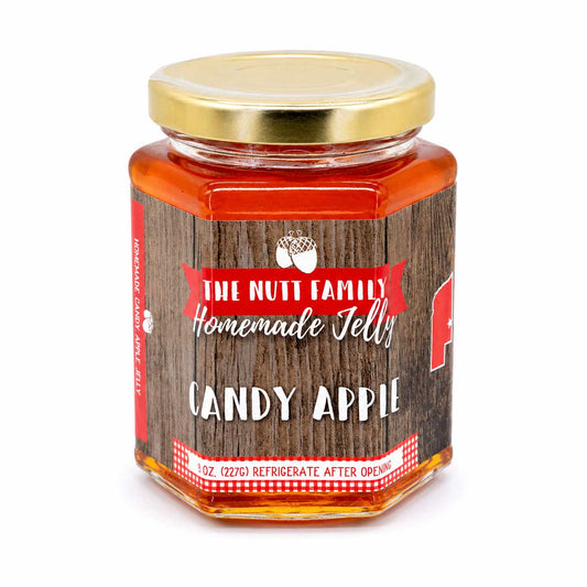 Sweet candy apple jelly in a 9 oz jar from Nutt Family Jams & Jellies, showcasing shiny red jelly with apple chunks.