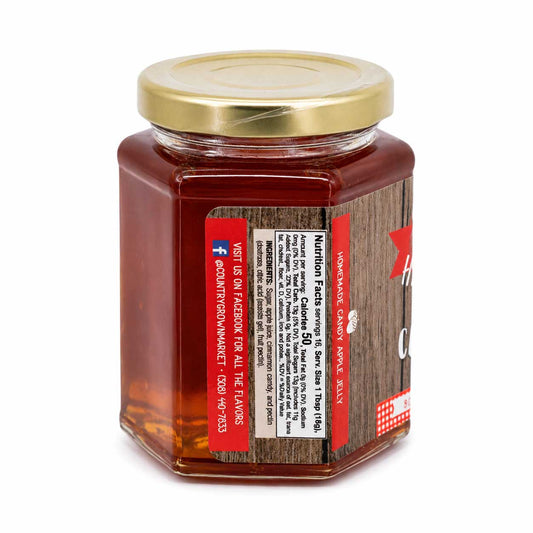 Sweet candy apple jelly jar from Nutt Family Jams & Jellies, 9 oz, showcasing vibrant red jelly with a glossy finish.