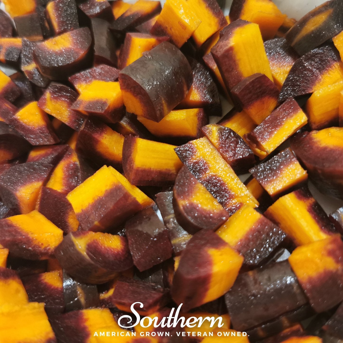 Cosmic Purple Carrot seeds by Southern Seeds, showing vibrant purple carrot seeds on a white background.