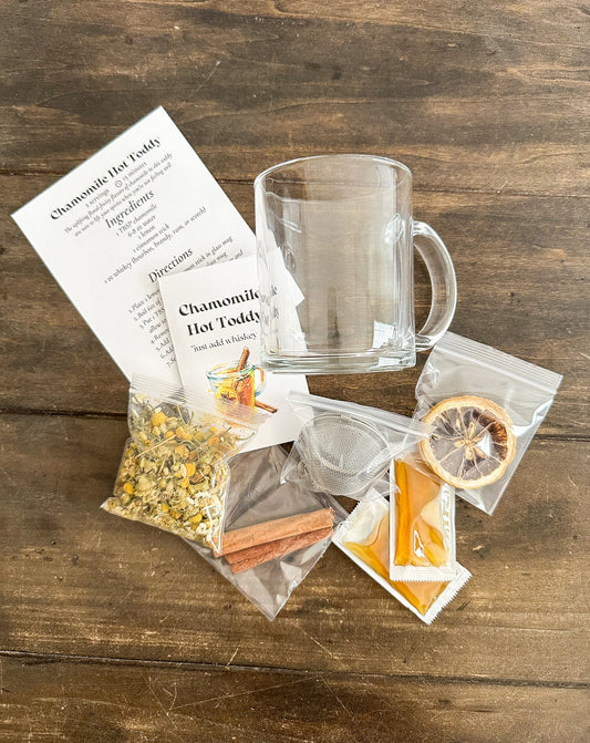 Herbalroseapothecary chamomile hot toddy gift set with herbal tea bags, mint, and a cozy mug for relaxing beverages.