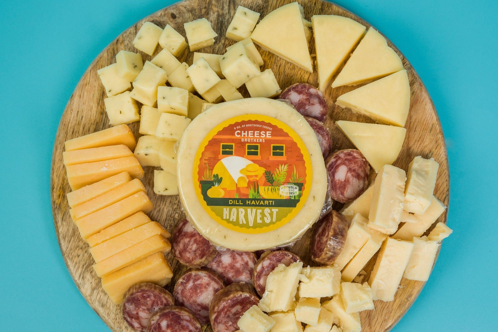 Cheese Brothers Inc. charcuterie box with assorted meats, cheeses, nuts, and crackers arranged for gifting or entertaining.
