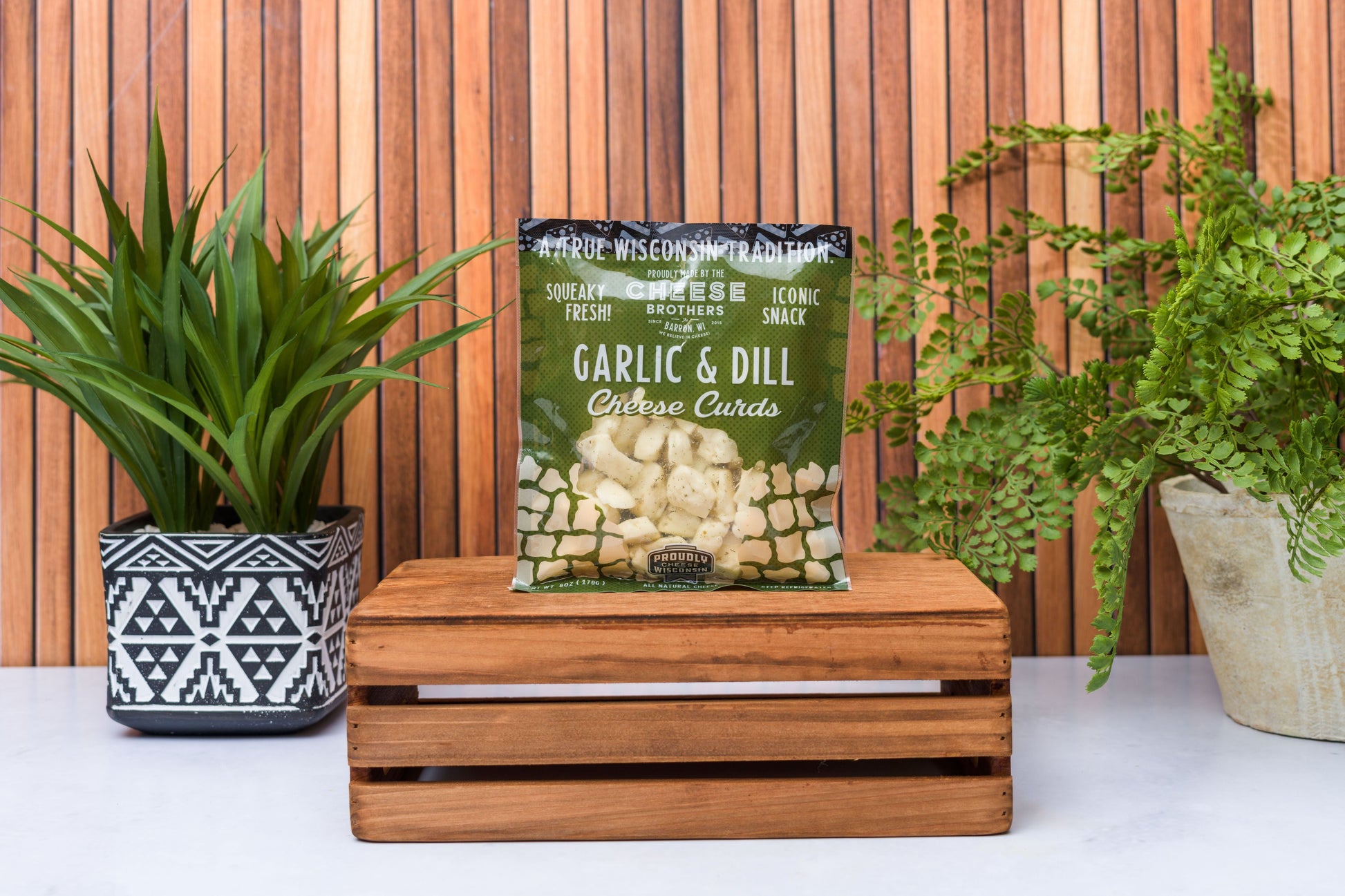 Wisconsin Cheese Brothers Inc. cheese curds sampler with 8 assorted fresh cheese curds in a gift bundle.