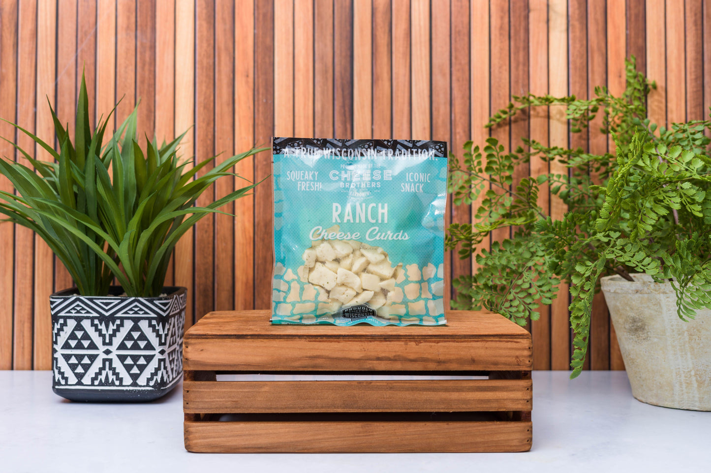Wisconsin Cheese Brothers Inc. cheese curds sampler with 8 fresh-pack cheese curds in a gift bundle, ready for enjoy­ment.