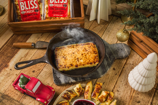 Golden Baked Bliss Cheese from Cheese Brothers, Inc. showing a baked cheese product in a single pack with a golden crust.