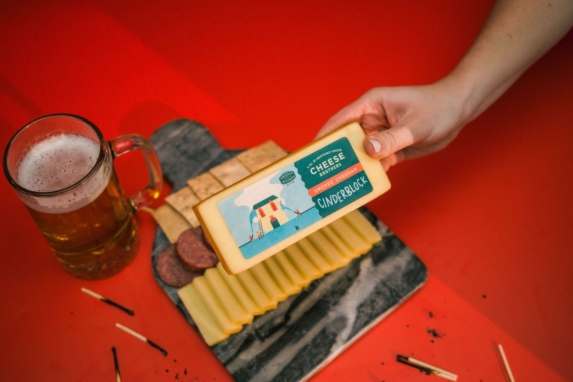 Smoked Cheddar cheese block from Cheese Brothers, Inc. with a rich, smoked flavor and smooth, firm texture.