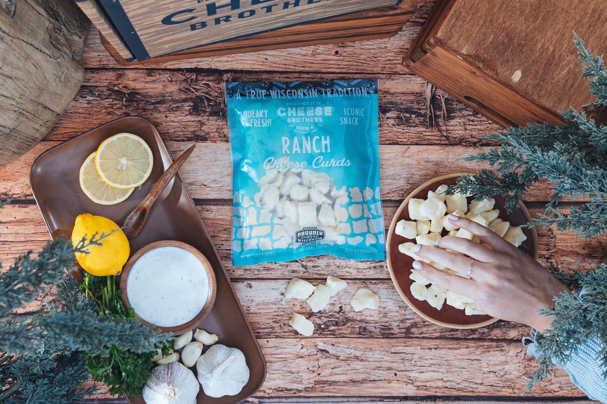 Fresh Ranch Cheese Curds from Cheese Brothers, Inc., showing a close-up of creamy cheese curds in a pack.