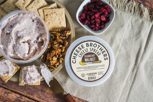 Creamy cranberry walnut cheese spread by Cheese Brothers, Inc., featuring a rich blend of cheese, cranberries, and walnuts.