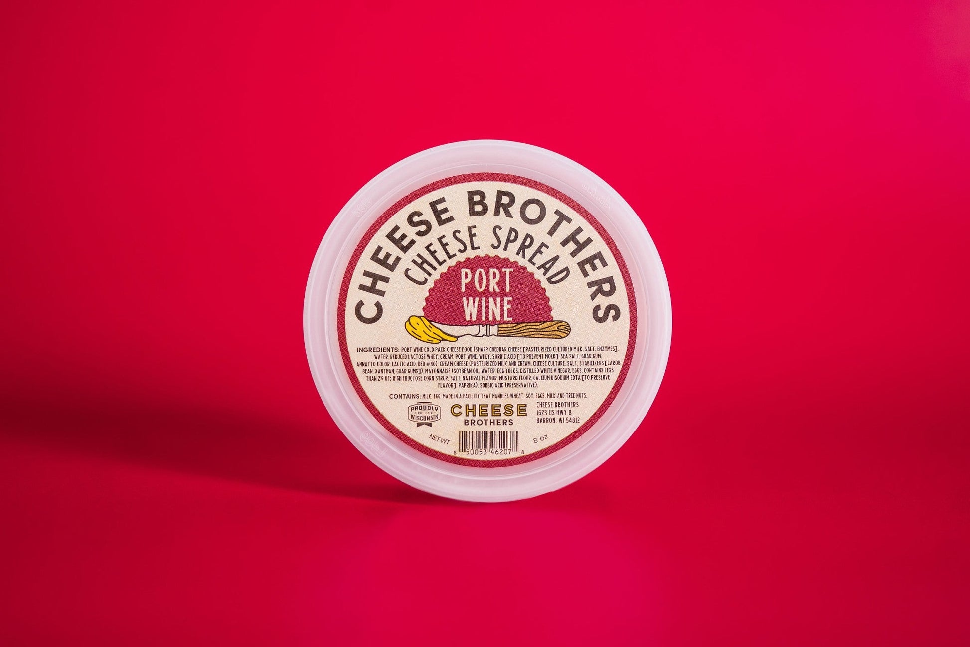 Creamy Port Wine Cheese Spread by Cheese Brothers, Inc., showcasing a smooth, rich cheese spread with a port wine flavor.